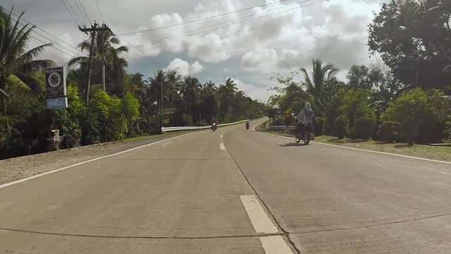 Village Road. Motion on motorbike. Philippines. Bohol island.