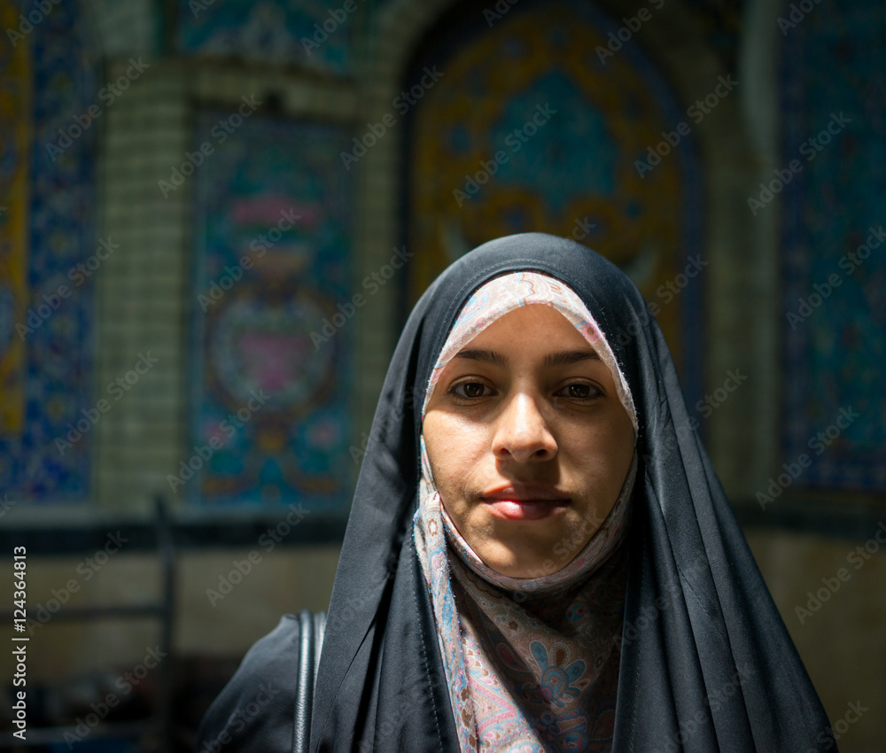 Wall mural Beautiful Muslim woman spending time on traditional Iranian baza