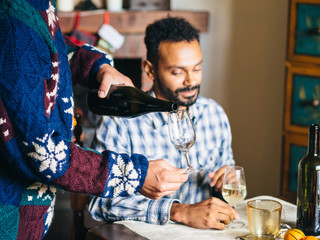 Christmas lunch with family, toast with sparkling wine in a traditional house