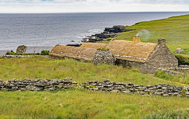 Dunrossness Croft House Museum in the Main Shetland Island northeast of the mainland of Scotland, United Kingdom,which depicts 19th Century Shetland family life - 124365613