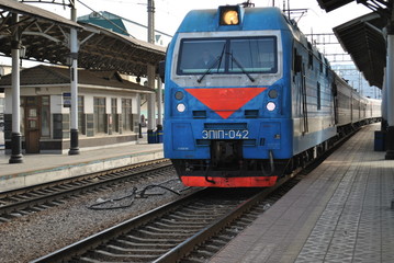 Fototapeta na wymiar The arrival of the train/ arrival of a train at the railway station