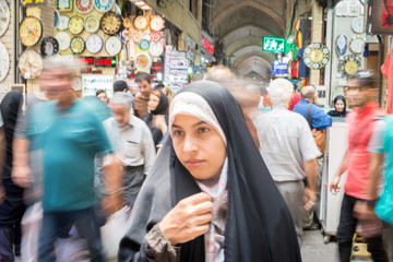 Fototapeta premium Beautiful Muslim woman spending time on traditional Iranian baza