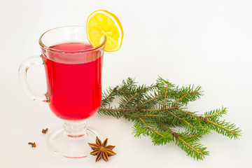  glass of mulled wine and a slice of lemon, star anise and fir