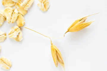 Foto op Plexiglas Grains of oats on a white background © 201122
