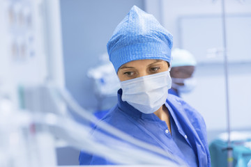 Anesthetist Working In Operating Theatre - 124370073
