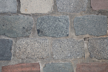 Grey and red brick stone street sidewalk,