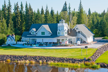 Beautiful home along the river in Fairbanks, Alaska - obrazy, fototapety, plakaty