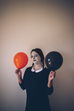 Spooky girl with balloons
