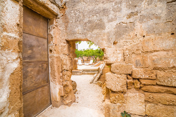 door in stone wall in Italian garden