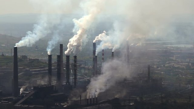 Industry Pipes Pollute the Atmosphere With Smoke