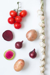 Knitted garlic, slice radish, slice beets, twig red tomatoes and