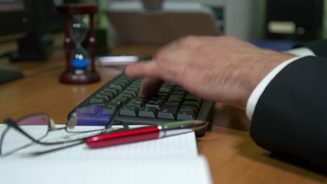 Businessman typing on a keyboard