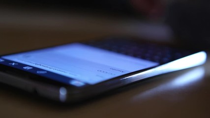 generic brand mobile phone texting typing reading scrolling watching pictures close up modern technology smartphone