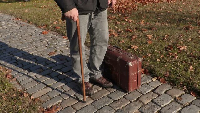 Disabled man take suitcase