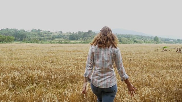Beautiful girl young attractive woman wheat field happy harvest hand touching slow motion happy emotion healthy and natural background slowmo slow mo emotions relax healthy organic hipster holidays
