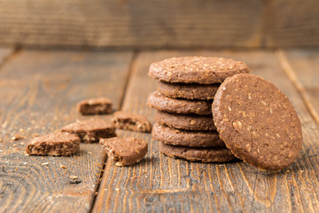 Stacked biscuits on natural wooden table.