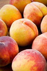 Juicy sweet peaches close-up on the table