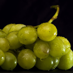 Bunch of grapes on a black slate stone