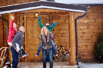 happy family enjoying in winter eve.