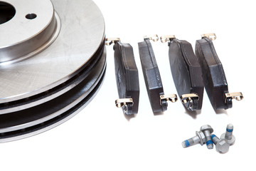 Set of new brake pads and discks isolated on white background