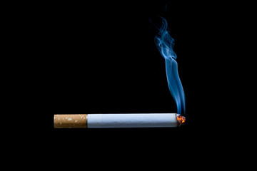 smoking cigarette on black background © Achira22