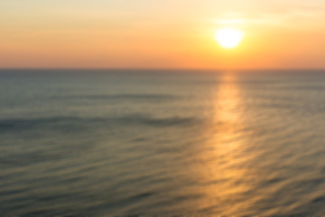 Obraz premium Blur image of ocean in sunset background.