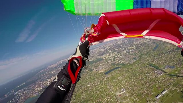 Skydiver is  opening parachute, pov