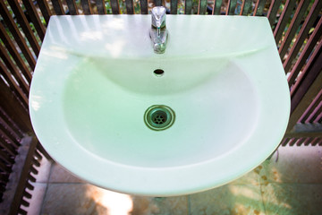 Dirty wash basin close up.
