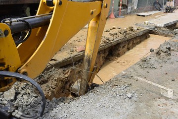 Backhoe removing earth