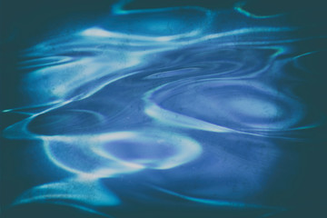 Abstract blue water wallpaper with analogue film grains
