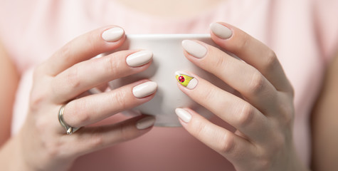 beautiful woman's hands with a cup
