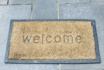 Welcome Mat On Stone Paving