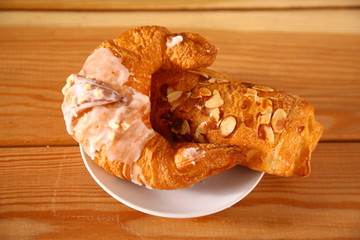 Croissant in the plate on the table