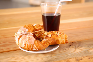 Croissant in the plate on the table