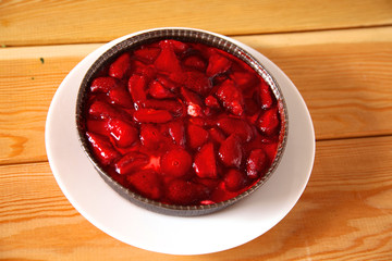 Strawberry dessert on the plate a wooden table