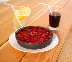Strawberry dessert on the plate a wooden table