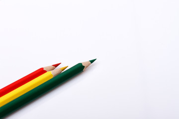 Colored pencils isolated over white background