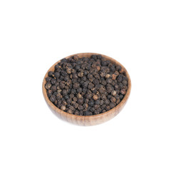 Black pepper in wooden bowl isolated on white background