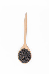Black pepper in spoon wooden bowl isolated on white background