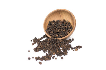 Black pepper in wooden bowl isolated on white background