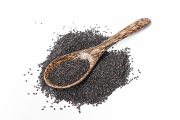 black sesame on wooden spoon isolated on white