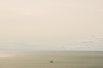 Fototapeta na wymiar Landscape of far ocean and fishing boat.