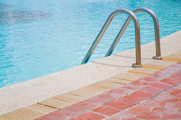 Obraz premium Public swimming pool and ladder close up.