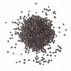 Black pepper on a white background..