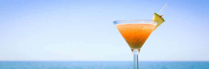 Concept of tropical vacation. Exotic cocktail on the pier. Luxur