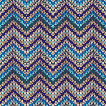 Seamless geometric ethnic spokes knitted pattern.