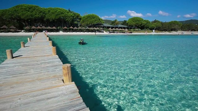 Bridge leading to Santa Giulia beach hotel resort in Corsica, France, Europe