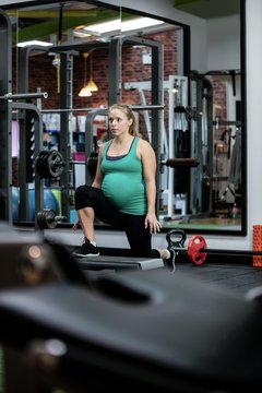 Pregnant woman performing exercise