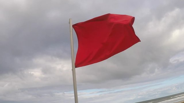 Red Danger Flag at the Beach before a Storm or Hurricane