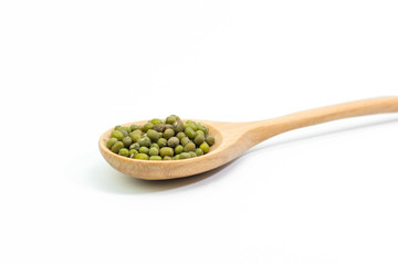 mung beans over wooden spoon isolated on white